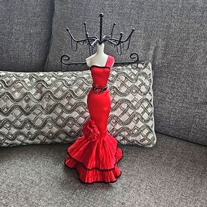 Jewelry stand. Red dress mannequin